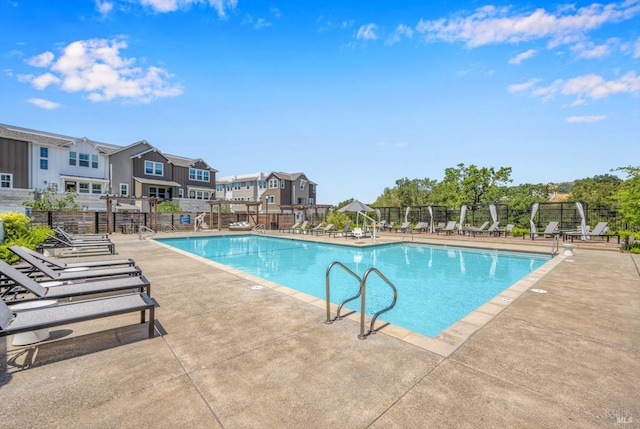 view of swimming pool with a patio area