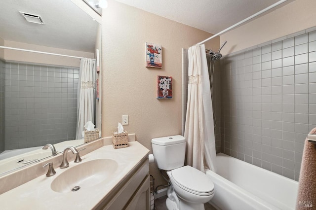 full bathroom featuring vanity, a textured ceiling, toilet, and shower / tub combo with curtain