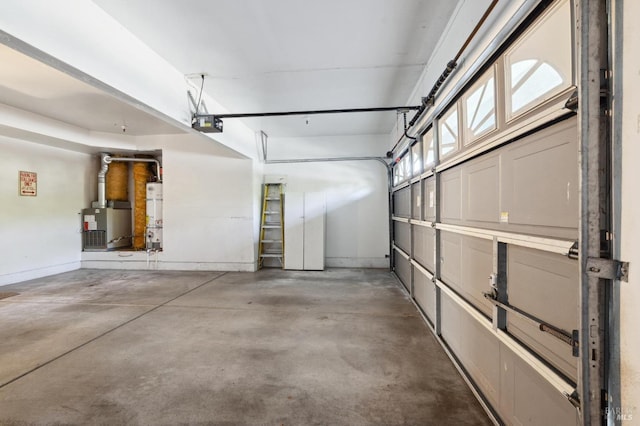 garage featuring water heater and a garage door opener