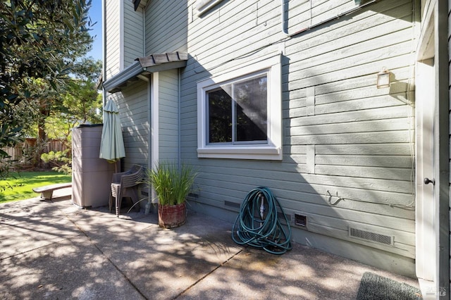 view of side of property with a patio