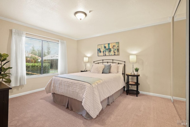 bedroom with ornamental molding, carpet floors, and a textured ceiling