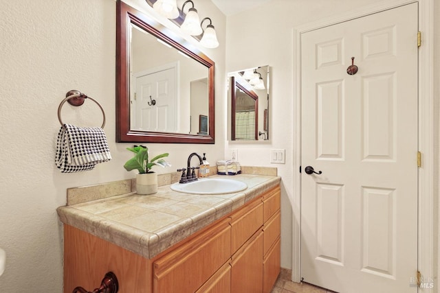 bathroom with vanity and tile patterned flooring