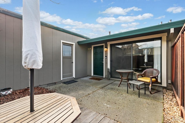 doorway to property with a patio