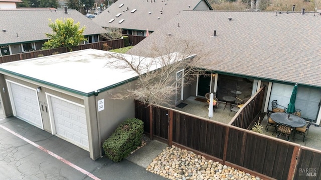 exterior space featuring a garage and a patio