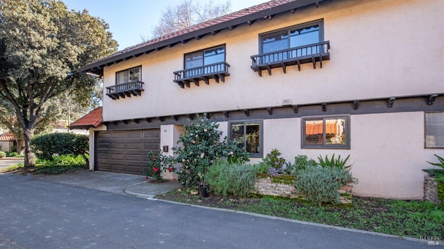 view of side of home featuring a garage