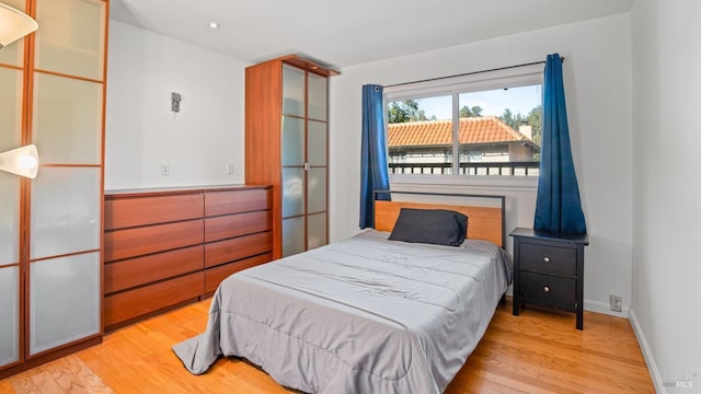 bedroom with light hardwood / wood-style floors