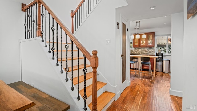 stairs with wood-type flooring