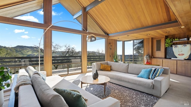 sunroom featuring lofted ceiling and wooden ceiling