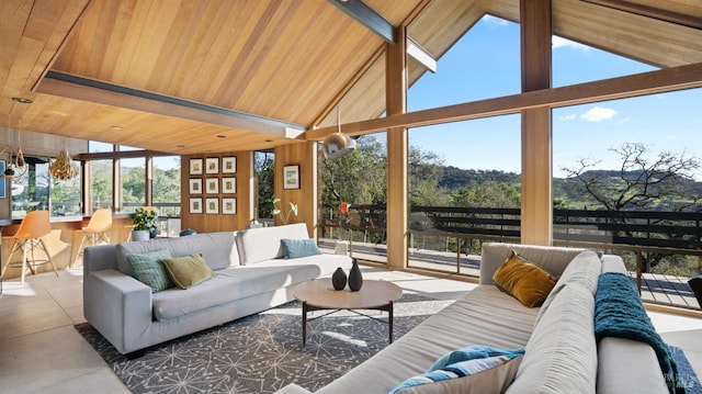 sunroom / solarium featuring vaulted ceiling and wooden ceiling