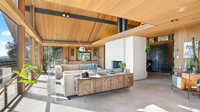 interior space with lofted ceiling and wooden ceiling