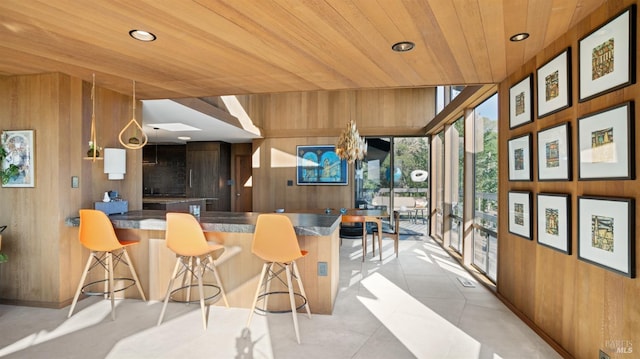 sunroom / solarium featuring wood ceiling