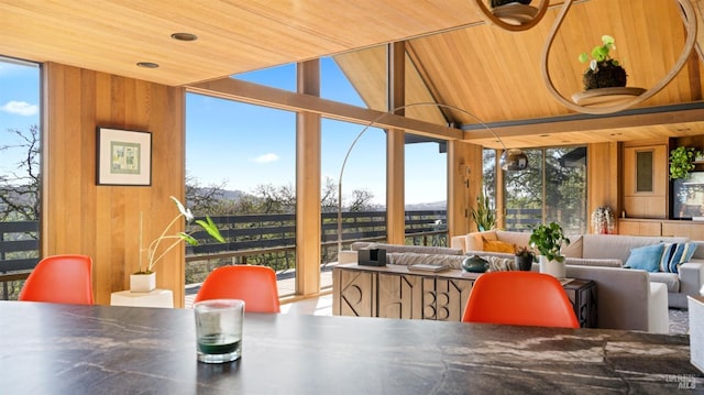 sunroom / solarium with lofted ceiling and wood ceiling