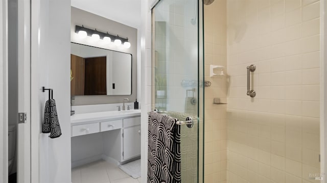 bathroom featuring walk in shower, vanity, toilet, and tile patterned flooring