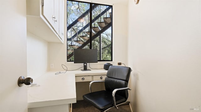 office featuring built in desk and plenty of natural light