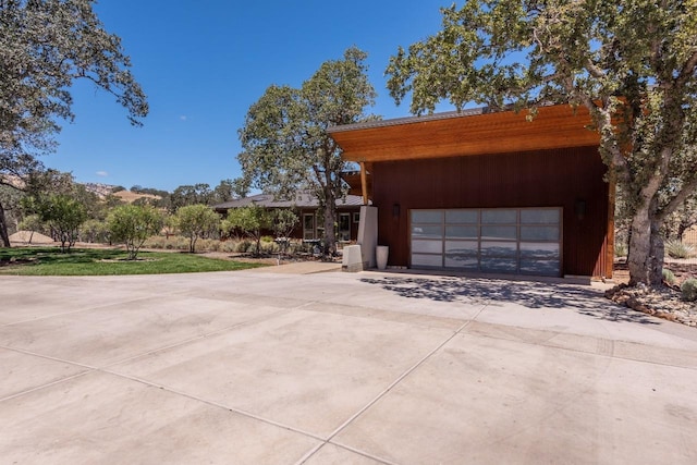 exterior space with driveway and an attached garage