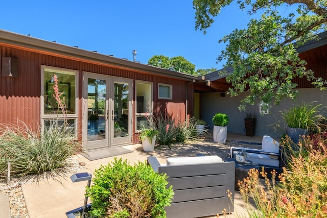 rear view of property with a patio and french doors