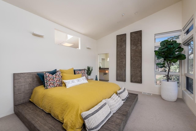carpeted bedroom featuring baseboards, high vaulted ceiling, and visible vents