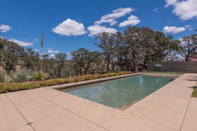 pool with a patio area