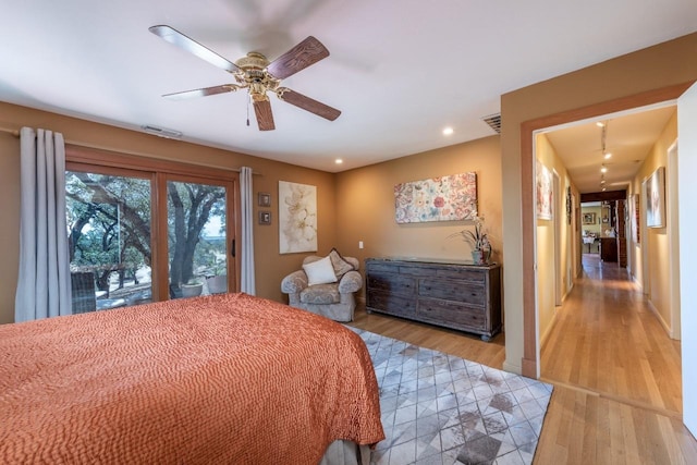 bedroom featuring a ceiling fan, access to exterior, visible vents, light wood-style floors, and recessed lighting