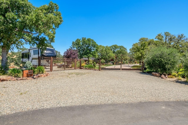 view of community with a gate and fence