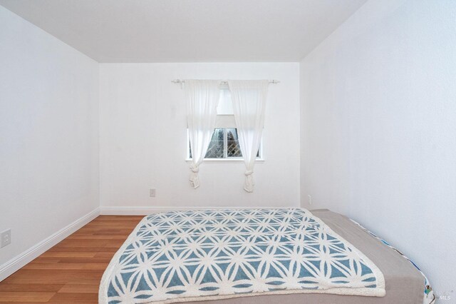 bedroom featuring hardwood / wood-style floors