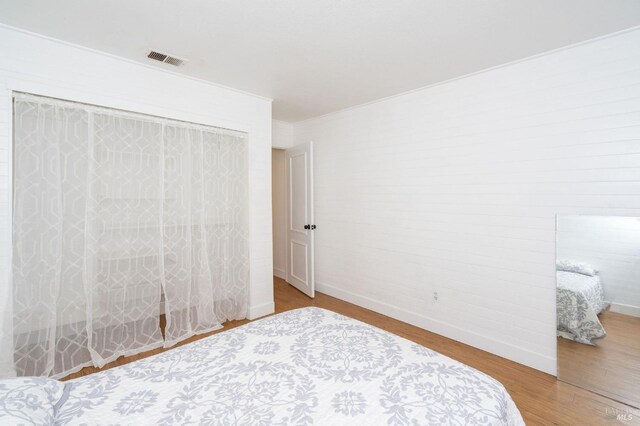 unfurnished bedroom featuring wood-type flooring