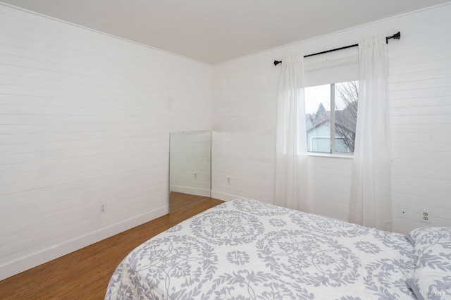 bedroom featuring hardwood / wood-style flooring