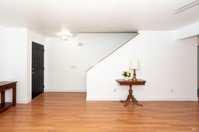 foyer entrance with light wood-type flooring