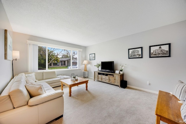 carpeted living room featuring a textured ceiling