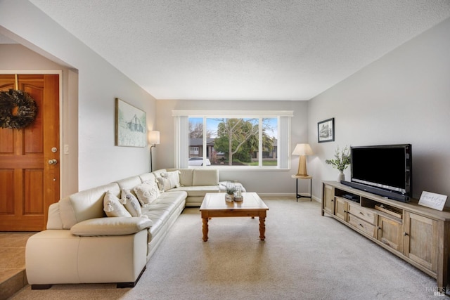 living room with light colored carpet and a textured ceiling