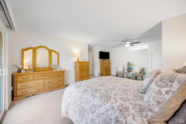 bedroom with ceiling fan and light carpet