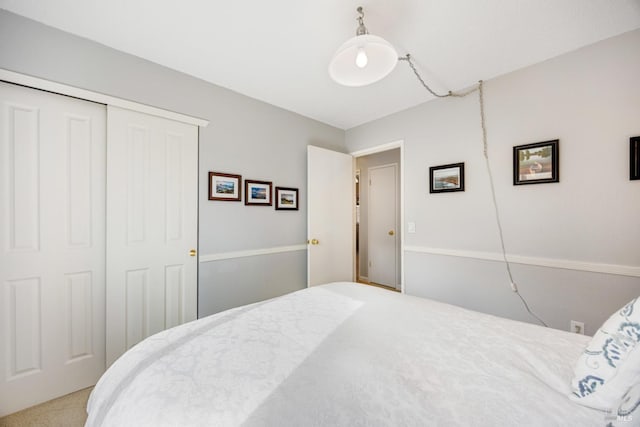 bedroom with a closet and carpet