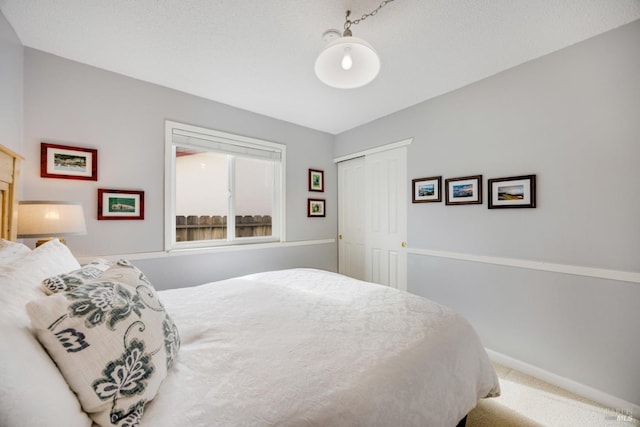 bedroom with a closet and carpet