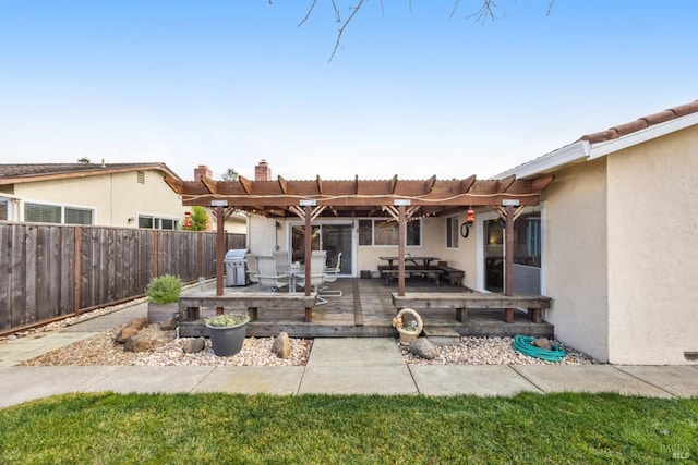 view of patio / terrace featuring a wooden deck, a grill, and a pergola