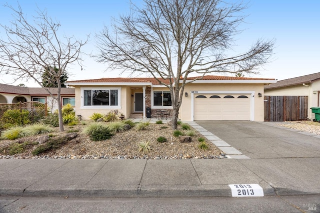 ranch-style house featuring a garage