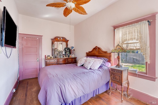 bedroom featuring dark wood-type flooring and ceiling fan