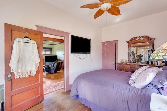 bedroom with hardwood / wood-style floors