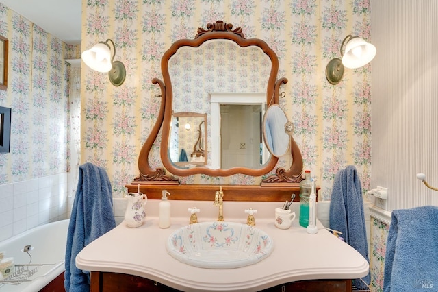 bathroom featuring vanity and a tub