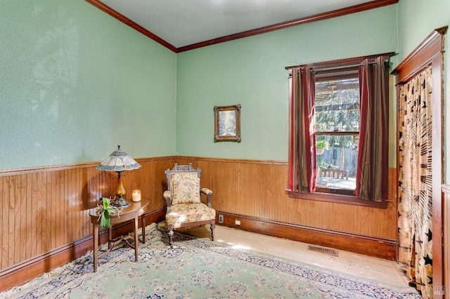 unfurnished room with ornamental molding and wooden walls