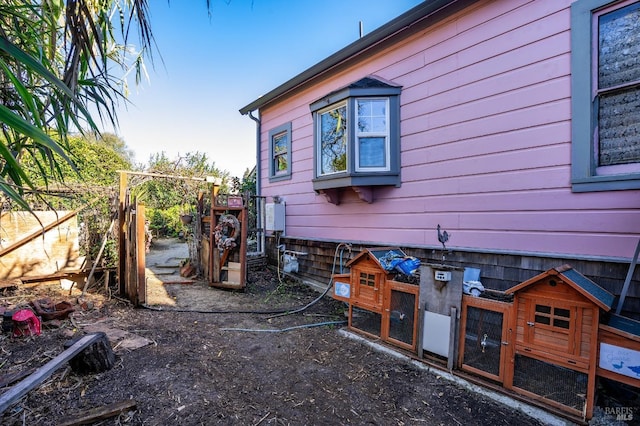 view of side of property featuring an outbuilding