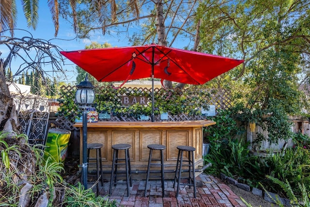 view of patio featuring an outdoor bar