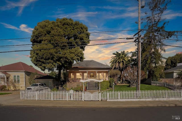 view of front facade featuring a garage and an outdoor structure