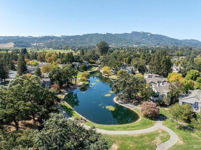 bird's eye view with a water and mountain view