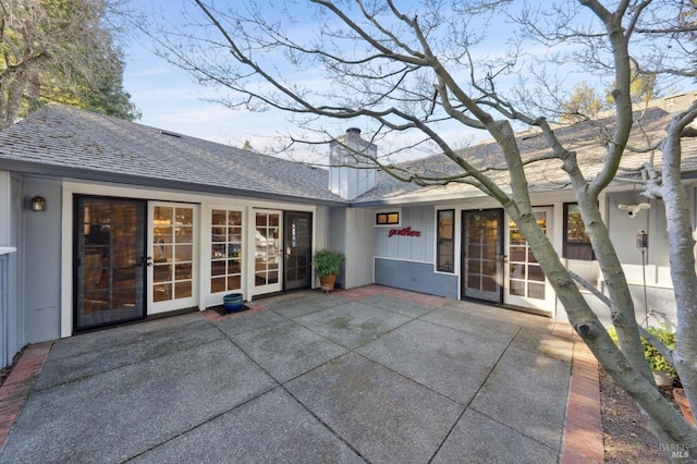 back of house featuring a patio and french doors