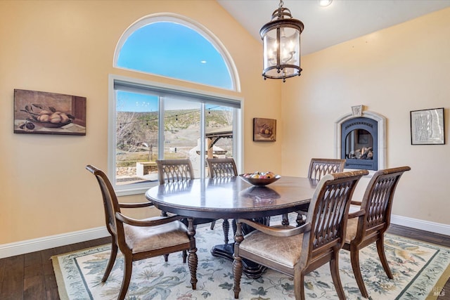 dining room with an inviting chandelier and dark hardwood / wood-style flooring