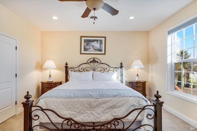 bedroom with light carpet and ceiling fan