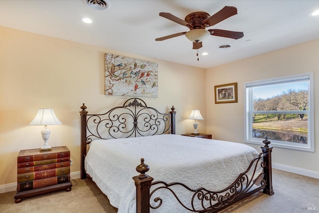 bedroom with light colored carpet and ceiling fan