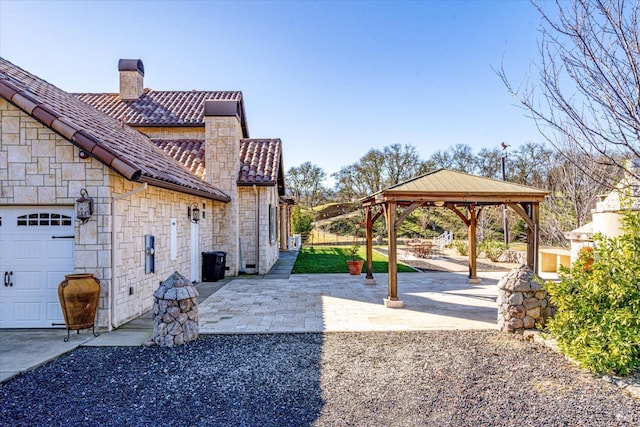 view of home's exterior with a gazebo