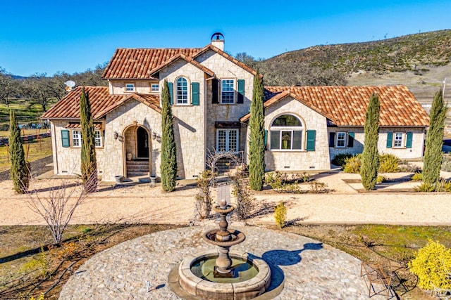 mediterranean / spanish-style home featuring a mountain view