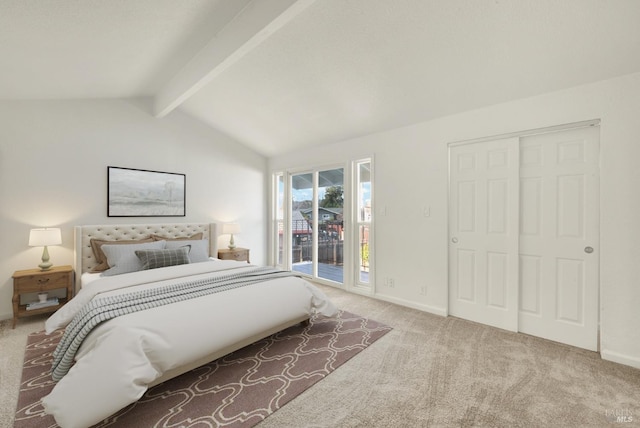 bedroom with vaulted ceiling with beams, a closet, carpet, and access to outside